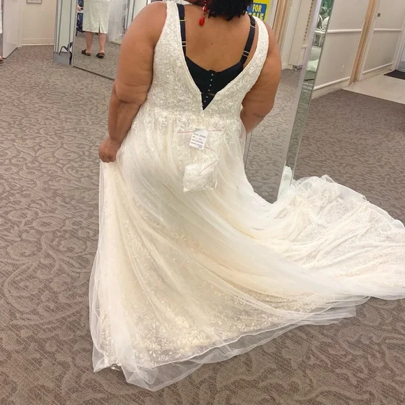This wedding dress is a size 20. Brand New and had never been worn before.
